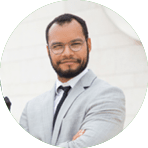 Successful interracial business team with tablet posing outside. Businessman and Muslim businesswomen standing outdoors, holding tablet and looking at camera. Diverse colleagues conce
